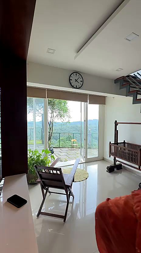 Terrace swing at Naz's Farm House looking out over the hills at sunrise