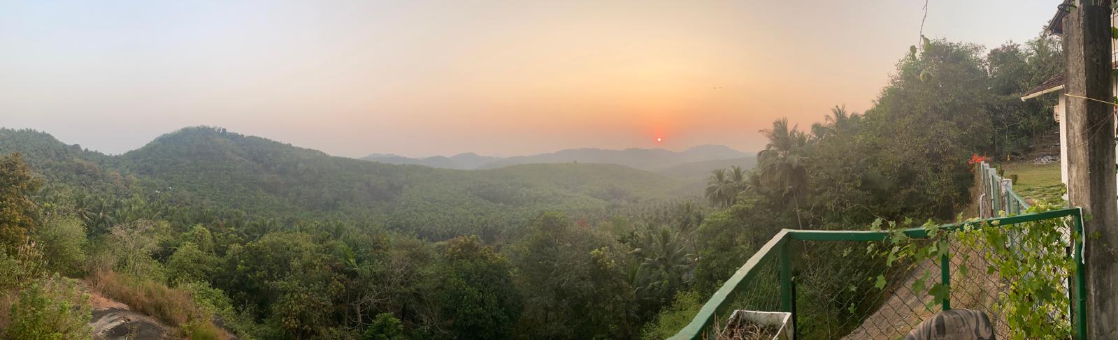 Sunset over the forested hills, seen from the terrace